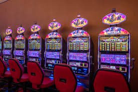 Adventure slot game interface showing exploration theme with treasure symbols